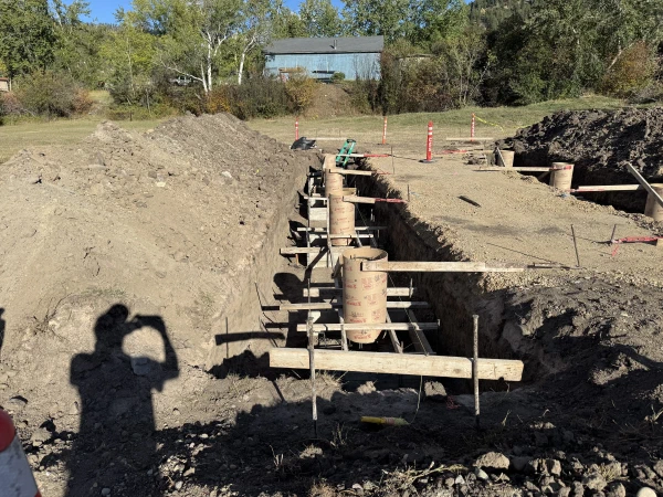 Forms set and braced in the trench, awaiting concrete.